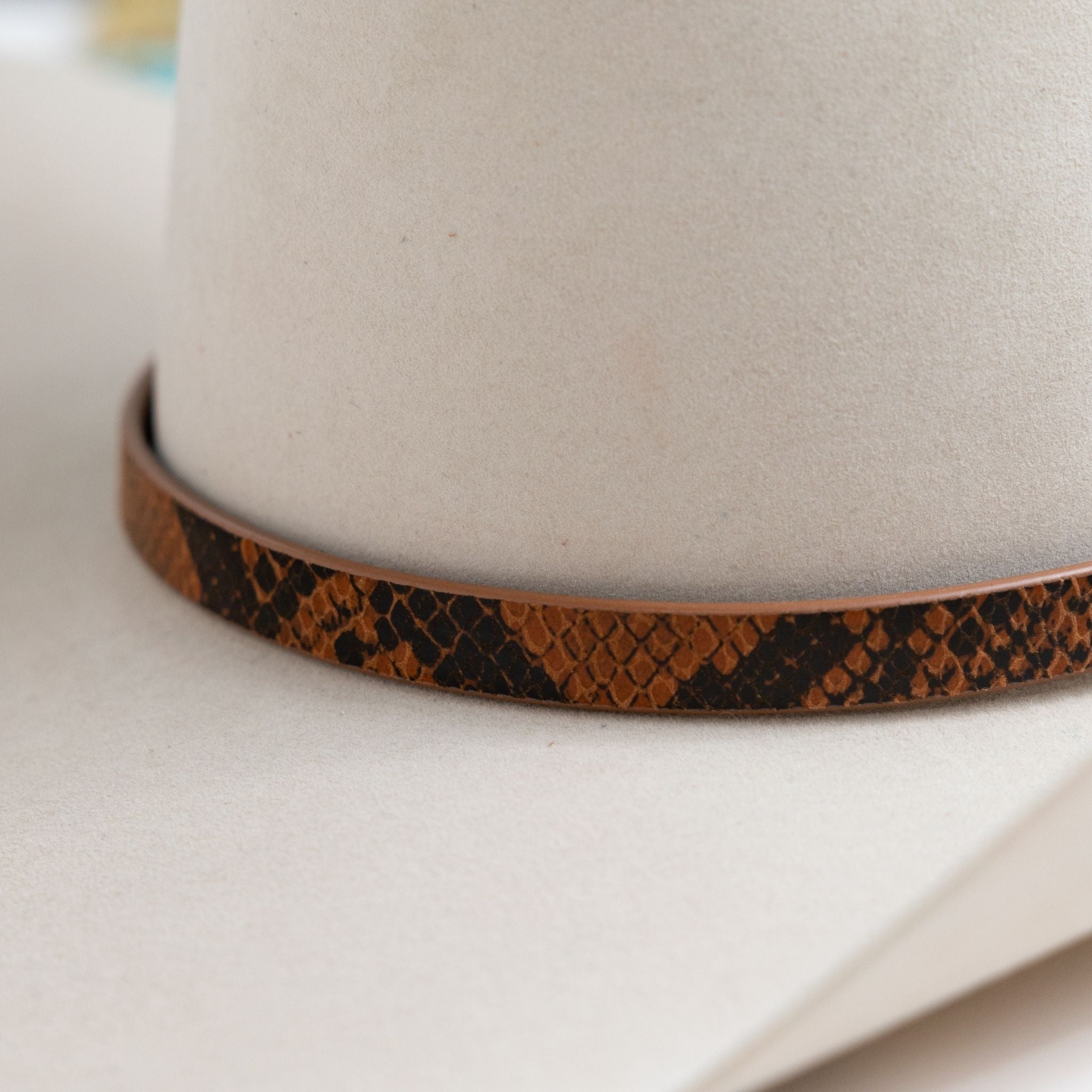 python hat band Images High Quality Grahic Python Print Leather Hat Band - Light Brown – Christina Greene