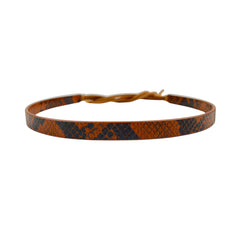 Brown leather belt with snake skin pattern on a white background